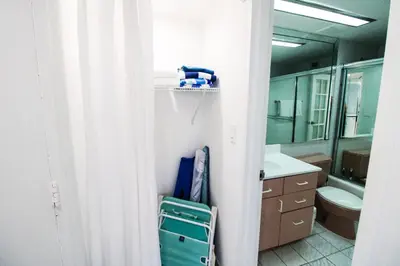 a bathroom with a sink and a toilet and a mirror at Castle 1133 Ocean view studio, Pool and Beach Access, FREE Parking, Tennis and more! in Miami Beach