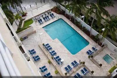 an overhead view of a swimming pool with lounge chairs and sidx sidx sidx at Gallery One Resort Access Fort Lauderdale Beach in Fort Lauderdale