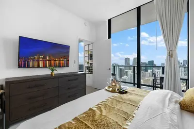 a bedroom with a large bed and a large window at PH 5107 Gale Luxury 1BR with Sea - Downtown Views in Miami