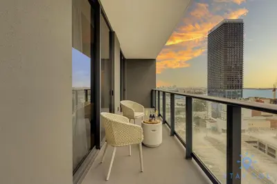 a balcony with chairs and a view of the city at Stylish 2BR with Pool & Balcony in Miami
