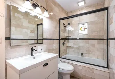 a bathroom with a sink and a tub and a toilet at Villa Treasure on the beach by The Gold Nests in Hollywood