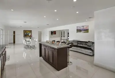 a large living room with a large island in the middle at Casa Ocaso in Miami