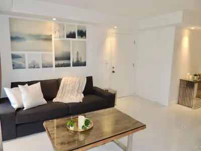 a living room with a couch and a coffee table at Lux design 2 bedroom unit sleep 4 in SoBe bst area in Miami Beach