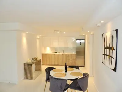 a kitchen and dining room with a table and chairs at Lux design 2 bedroom unit sleep 4 in SoBe bst area in Miami Beach