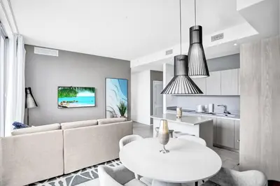 a living room with a couch and a table at Hollywood SkyView Penthouse in Hollywood