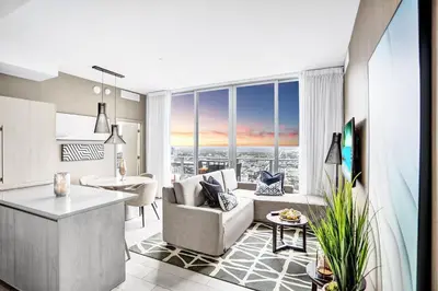 a kitchen and living room with a view of a city at Hollywood SkyView Penthouse in Hollywood