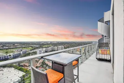 a balcony with a table and chairs on a building at Hollywood SkyView Penthouse in Hollywood