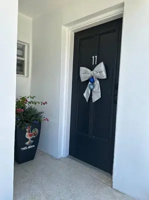 a black door with a bow on it at Villa Clara Blue-Little Havana in Miami