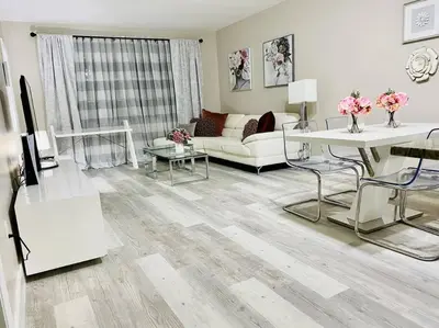 a living room with a couch and a table at Modern 1BR 1BA Condo 1Block to Aventura Mall in Aventura