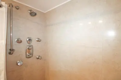 a bathroom with a shower with a glass door at Castle L5 Oceanview Double-loft with pool, beach access, tennis, free parking! in Miami Beach