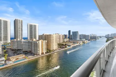 a view of a river in a city with tall buildings at Escape to Beachwalk Resort in Chic Apartment in Hallandale Beach