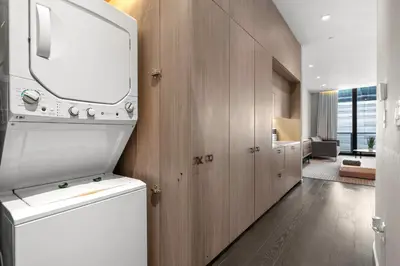 a kitchen with a washer and dryer in a room at Luxury King Suite W City view at SLS Brickell in Miami