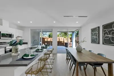 a kitchen and dining room with a table and chairs at Up to 12 guest Modern Villa near Wynwood! 27 in Miami