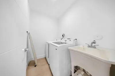 a white bathroom with a sink and a washing machine at Up to 12 guest Modern Villa near Wynwood! 27 in Miami