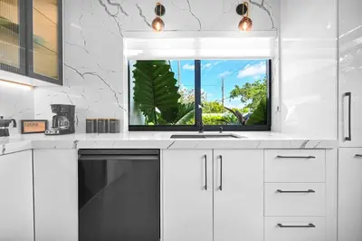 a kitchen with a sink and a window at Stylish Oasis in Design District, Near Wynwood in Miami