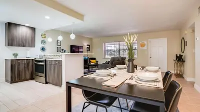 a kitchen and dining room with a table and chairs at Serene 1BR Haven Fort Lauderdale in Fort Lauderdale