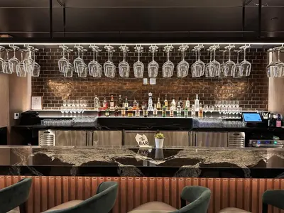 a bar with glasses on a brick wall at Wonderful 1 Bed - Amazing views in Miami