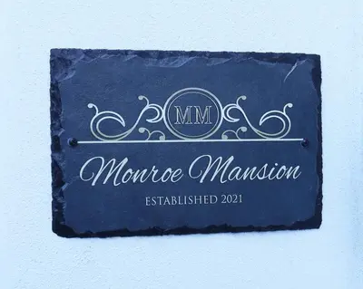 a sign for a mensumesumesumesumesumesumesumesumesumesurance at Luxury Mansion, Game Room, Pool, Rooftop, Skyline, Walk to Las Olas in Fort Lauderdale