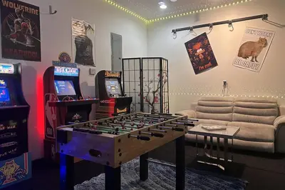 a living room with a chess board and video games at Luxury Mansion, Game Room, Pool, Rooftop, Skyline, Walk to Las Olas in Fort Lauderdale