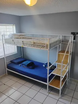 a room with two bunk beds and a ladder at Beds & Sheets little Havana in Miami