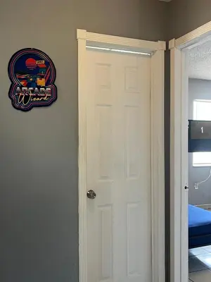 a door in a room with a sign on the wall at Beds & Sheets little Havana in Miami
