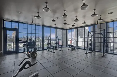a gym with a view of a city skyline at New 2-Bdrm Downtown Miami Apartment with Bay Vista in Miami