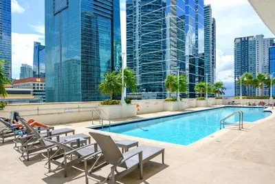 a swimming pool in a city with tall buildings at Beautiful Condo w Breathtaking Views! in Miami