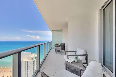 a balcony with a view of the ocean at Seaside Elegance 1BR Retreat Stunning View in Hollywood