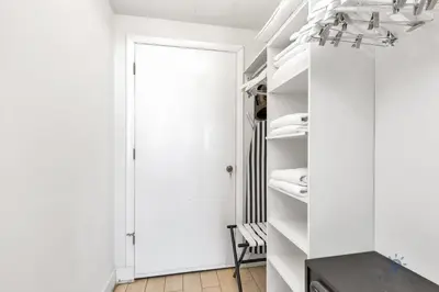 a room with a closet with white walls and a door at Seaside Elegance 1BR Retreat Stunning View in Hollywood