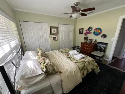 a bedroom with a bed and a ceiling fan at Wilton Manors A Mens Oasis in Fort Lauderdale