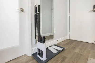 a mirror in a room with two towels on a floor at Luxe ocean drive condo in miami south beach in Miami Beach
