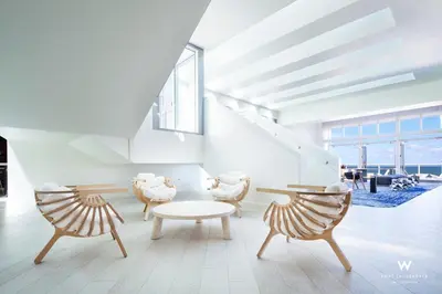 a living room with two chairs and a table at Stylish 1BR Suite with 5 Star Amenities and Stunning Views in Fort Lauderdale
