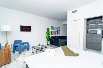 a bedroom with a bed and a living room at Central Miami 1BR Suite Close to Beach & Downtown in Miami