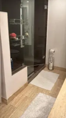 a bathroom with a shower with a glass door at Penthouse 2 stroy 2 bedroom water views to share in Miami