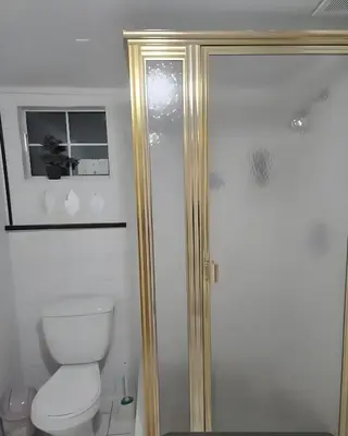 a bathroom with a toilet and a shower at Azucar Miami in Miami