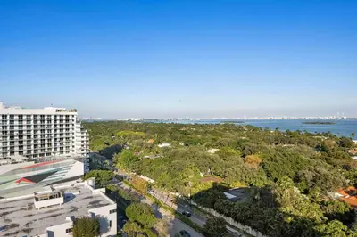 an aerial view of a building and the water at Luxury & Modern Condo in Design District with Pool in Miami
