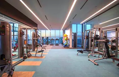 a gym with treadmills and machines in a building at Elegant Condo 2BR w Beautiful City Views in Miami