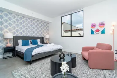 a bedroom with a bed and a chair at Beautiful 1BR in Little Havana Close with King Bed Near Brickell & Marlins Park in Miami