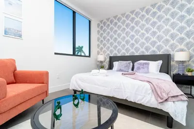 a bedroom with a bed and a glass table at Relaxing 1BR in Miami Close to Brickell and South Beach in Miami