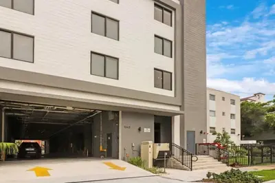 a building with a garage with a car in it at Well Located 1BR with King Bed, Laundry and Parking Option Near Brickell and Marlins Park in Miami