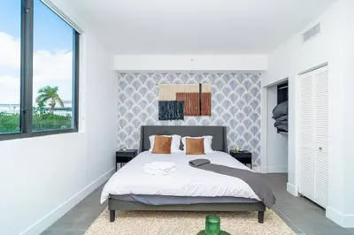 a bedroom with a bed and a large window at Miami 1BR New Oasis with King Bed Near Brickell & Marlins Park in Miami