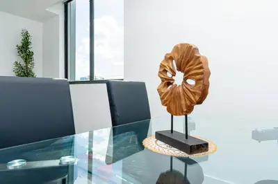 a glass table with a sculpture on top of it at Miami 2BR Getaway with King Beds Near Marlins Park & Calle Ocho in Miami