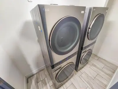 two washing machines are in a corner of a room at Miami 2BR Getaway with King Beds Near Marlins Park & Calle Ocho in Miami