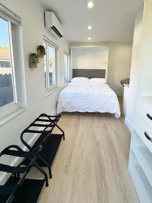 a bedroom with a bed and a chair in it at Quiet Shenandoah Retreat, Central Miami in Miami