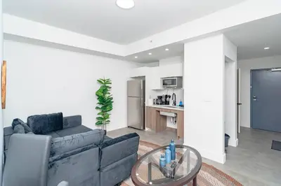 a living room with a couch and a glass table at Prime Miami Retreat with King Bed Near Brickell & Marlins Park in Miami