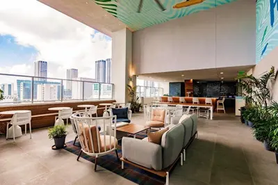 a restaurant with chairs and tables and a view of the city at Exclusive Condo w Beautiful City Views and Full Amenities! in Miami