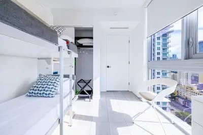 a bedroom with a bunk bed and a balcony at Charming 2 BR Downtown Miami 2106 Free Parking in Miami