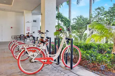 a row of bikes parked in front of a building at Spectacular Near Beach - 2 BR Apartment in Hallandale Beach