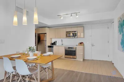 a kitchen and dining room with a table and chairs at Great views Apartment with Pool-Balcony-Gym in Hallandale Beach