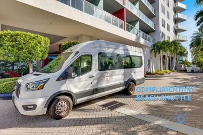 a white van parked in front of a building at Stylish Apartment 2BD 2BTH in Hallandale Beach